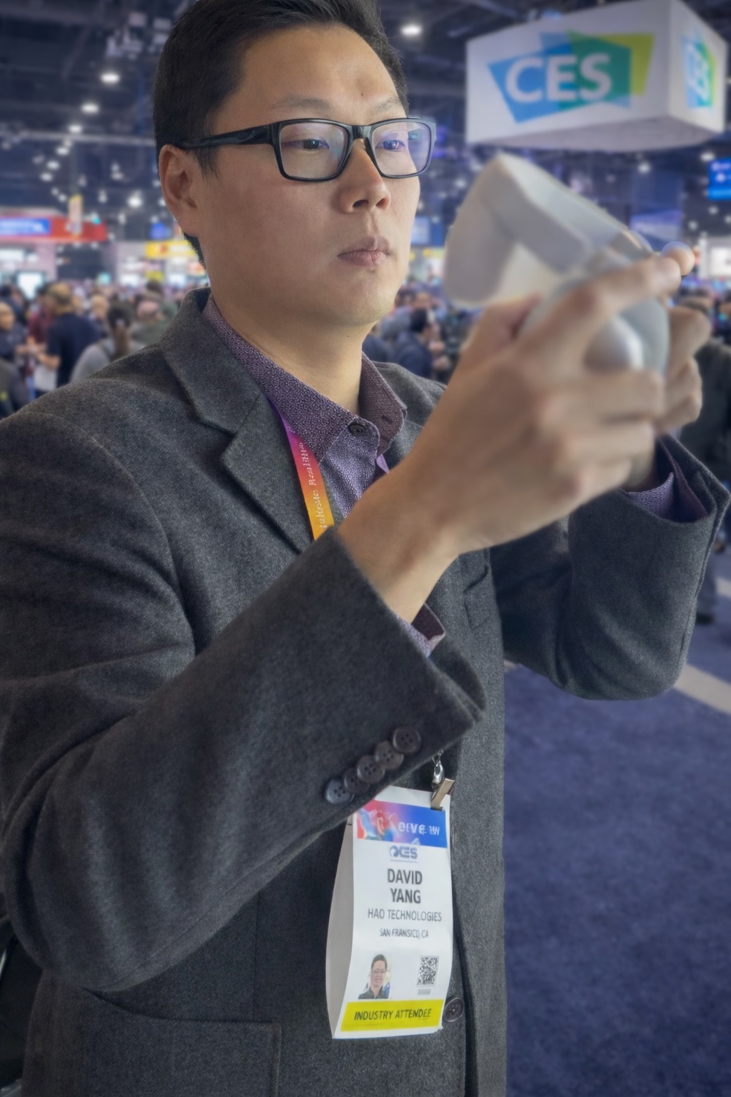 David Yang at CES evaluating a product